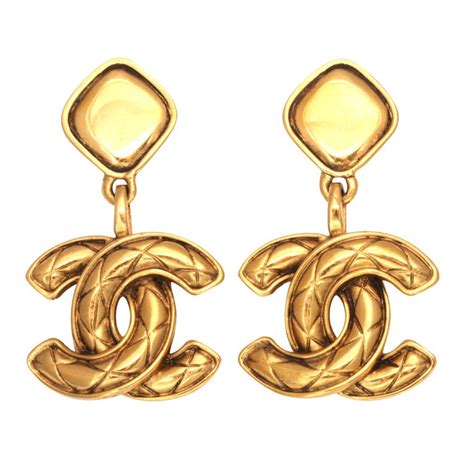 silver chanel dangle earrings|chanel quilted style dangle earrings.